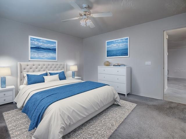 carpeted bedroom featuring a ceiling fan and baseboards