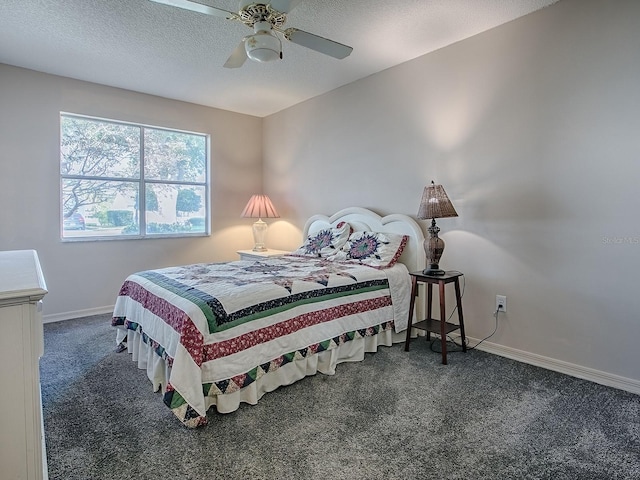 bedroom with baseboards, a ceiling fan, carpet flooring, and a textured ceiling