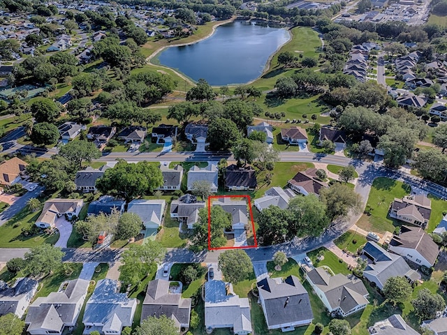 bird's eye view with a residential view and a water view