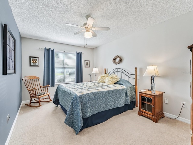 bedroom featuring baseboards, carpet flooring, and a textured ceiling
