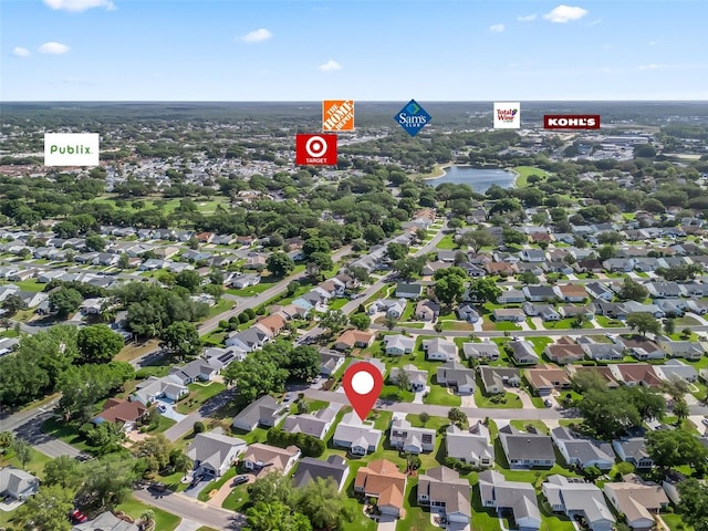 drone / aerial view with a residential view and a water view