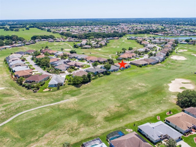 drone / aerial view with a residential view and golf course view