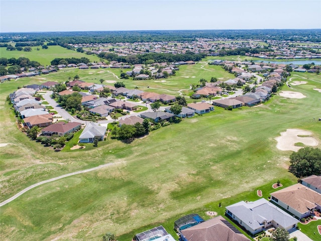 birds eye view of property with view of golf course and a residential view