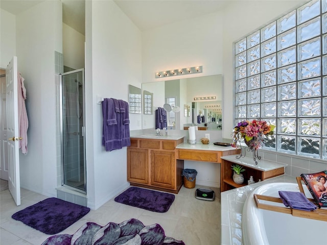full bath with a bath, a shower stall, tile patterned flooring, and vanity