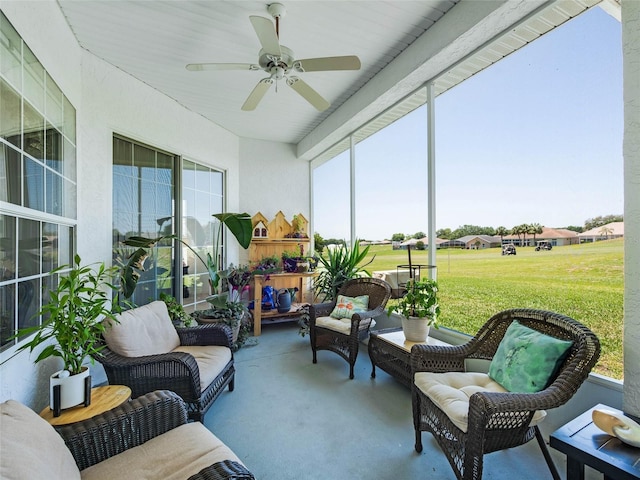 sunroom with ceiling fan