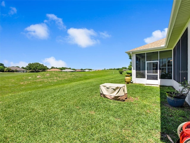 view of yard featuring a sunroom