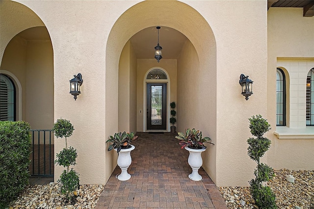 entrance to property with stucco siding