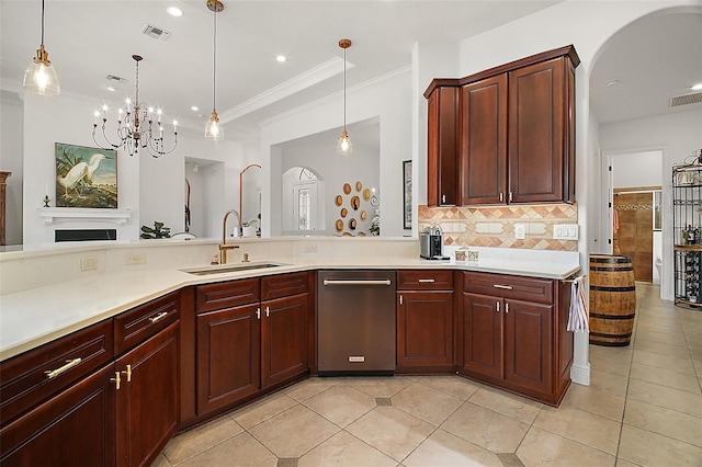 kitchen with arched walkways, tasteful backsplash, visible vents, light countertops, and a sink