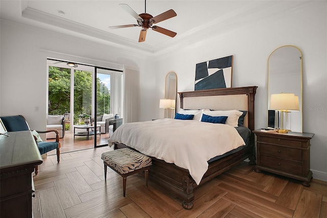 bedroom featuring ornamental molding, access to exterior, a raised ceiling, and a ceiling fan