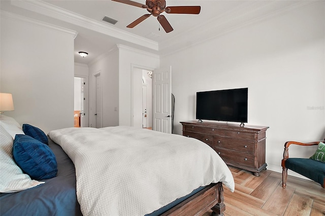 bedroom with visible vents, baseboards, crown molding, and a ceiling fan