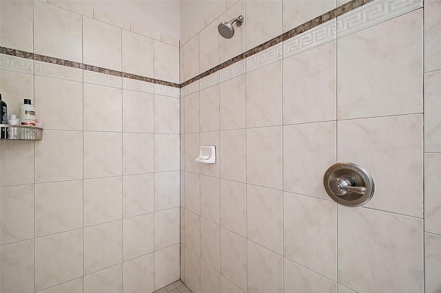 full bath with a tile shower