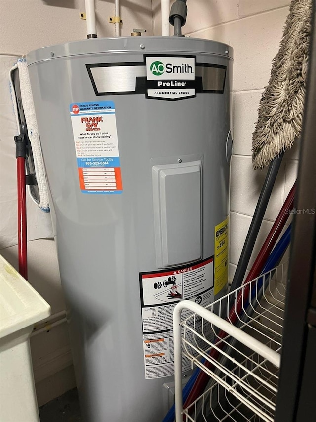 utility room featuring electric water heater