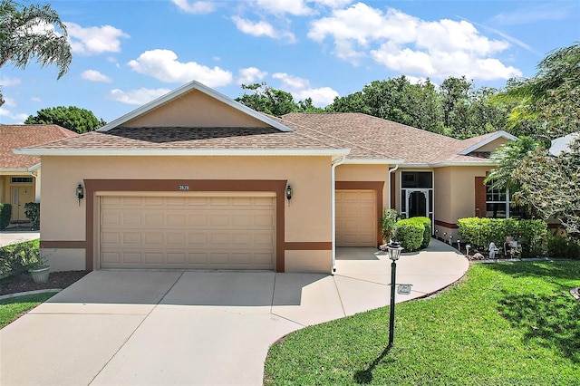 3828 Arbordale Ct, Leesburg, FL 34748 - ranch-style house featuring roof with shingles, an attached garage, driveway, and stucco siding