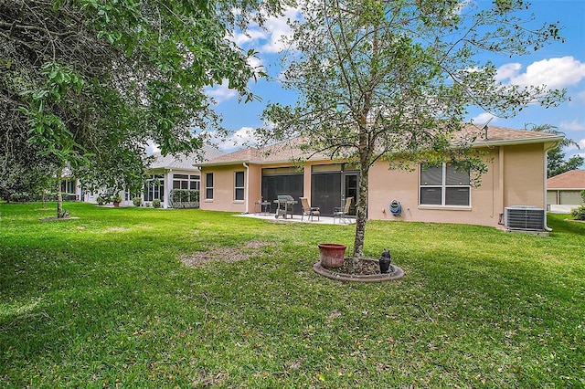 3828 Arbordale Ct, Leesburg, FL 34748 - rear view of property featuring a patio area, central air condition unit, stucco siding, and a lawn