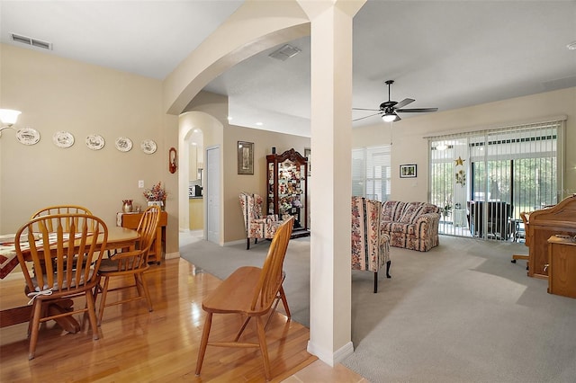 3828 Arbordale Ct, Leesburg, FL 34748 - dining room featuring arched walkways, ceiling fan, baseboards, and visible vents