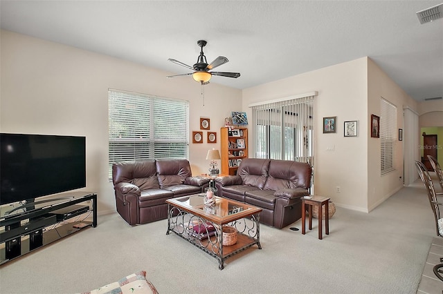 3828 Arbordale Ct, Leesburg, FL 34748 - carpeted living area featuring baseboards, a ceiling fan, and visible vents