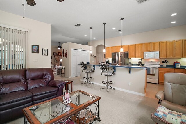 3828 Arbordale Ct, Leesburg, FL 34748 - living room with recessed lighting, light tile patterned floors, visible vents, ceiling fan, and arched walkways