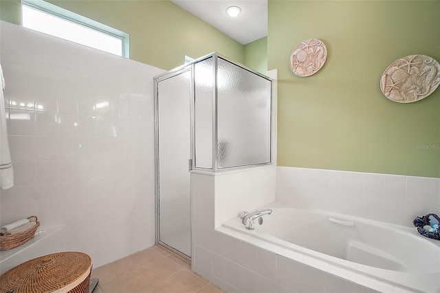 3828 Arbordale Ct, Leesburg, FL 34748 - full bathroom with tile patterned floors, a bath, and a stall shower