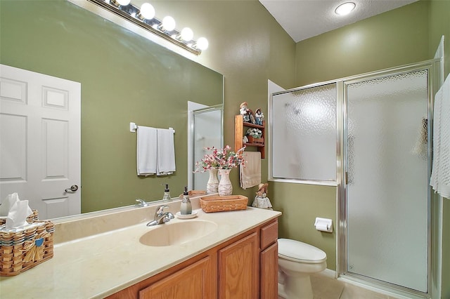 3828 Arbordale Ct, Leesburg, FL 34748 - bathroom featuring tile patterned flooring, toilet, a stall shower, and vanity