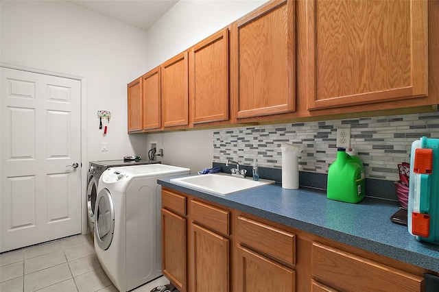 3828 Arbordale Ct, Leesburg, FL 34748 - laundry room featuring light tile patterned floors, washing machine and dryer, a sink, and cabinet space