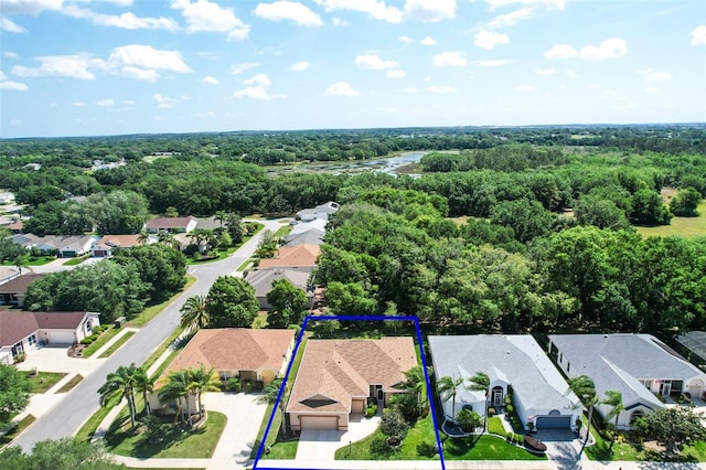 3828 Arbordale Ct, Leesburg, FL 34748 - drone / aerial view featuring a wooded view and a residential view