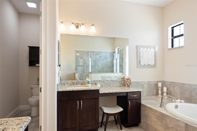 full bath featuring a tile shower, a garden tub, vanity, tile patterned flooring, and toilet