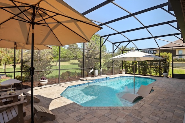 outdoor pool featuring a patio and glass enclosure