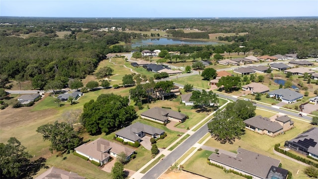 bird's eye view featuring a water view and a residential view