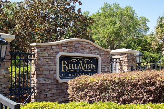 community sign featuring fence