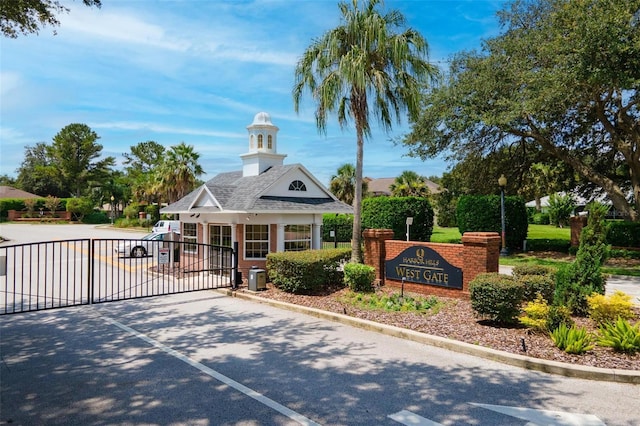 exterior space with a gate and driveway