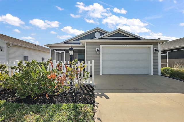 6248 Siverson Ter, The Villages, FL 32163 - ranch-style house with an attached garage, a sunroom, and driveway