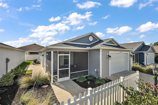 6248 Siverson Ter, The Villages, FL 32163 - view of front facade featuring a garage, a fenced backyard, a sunroom, a shingled roof, and board and batten siding