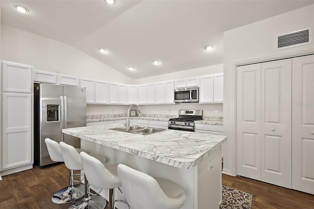 6248 Siverson Ter, The Villages, FL 32163 - kitchen with visible vents, lofted ceiling, recessed lighting, a sink, and appliances with stainless steel finishes