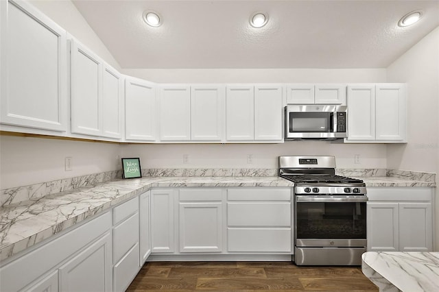 6248 Siverson Ter, The Villages, FL 32163 - kitchen featuring dark wood-type flooring, light countertops, white cabinetry, a textured ceiling, and appliances with stainless steel finishes