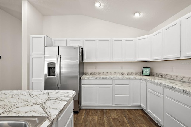 6248 Siverson Ter, The Villages, FL 32163 - kitchen with dark wood-style flooring, lofted ceiling, stainless steel fridge, recessed lighting, and white cabinetry