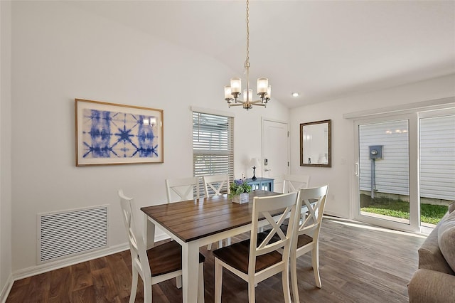 6248 Siverson Ter, The Villages, FL 32163 - dining room with visible vents, an inviting chandelier, wood finished floors, baseboards, and vaulted ceiling