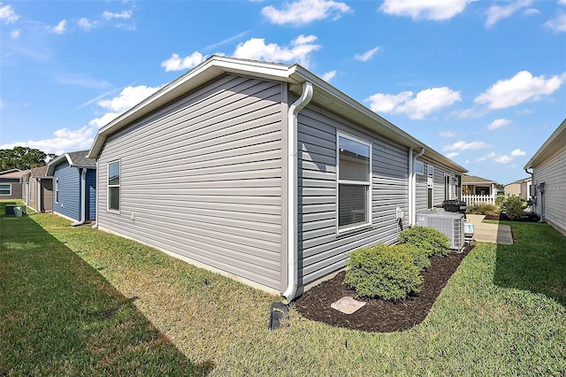 6248 Siverson Ter, The Villages, FL 32163 - view of property exterior featuring a patio, a yard, and central AC