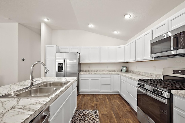 6248 Siverson Ter, The Villages, FL 32163 - kitchen featuring a sink, white cabinetry, appliances with stainless steel finishes, and lofted ceiling