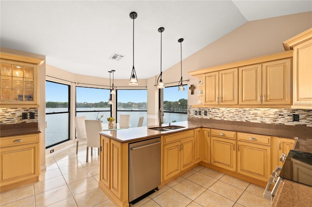 kitchen featuring light tile patterned flooring, appliances with stainless steel finishes, a sink, backsplash, and visible vents