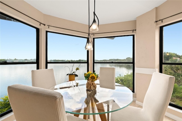 dining room with a water view