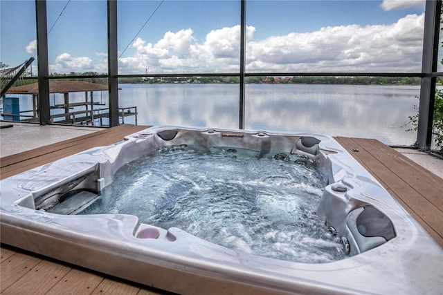 view of swimming pool with a water view