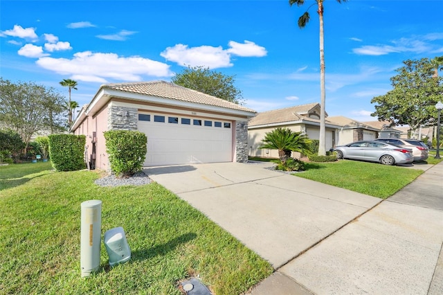 9081 Saint Andrews Way, Mount Dora, FL 32757 - single story home with a tiled roof, stone siding, a front lawn, stucco siding, and a garage
