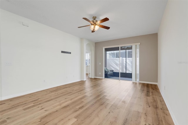 9081 Saint Andrews Way, Mount Dora, FL 32757 - spare room featuring a ceiling fan, light wood-style flooring, and baseboards