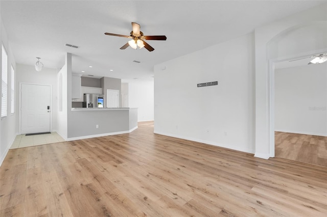 9081 Saint Andrews Way, Mount Dora, FL 32757 - unfurnished living room with ceiling fan, light wood-style floors, baseboards, and recessed lighting