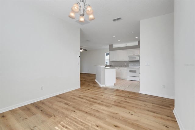 9081 Saint Andrews Way, Mount Dora, FL 32757 - unfurnished living room with light wood-style floors, a chandelier, recessed lighting, baseboards, and a ceiling fan