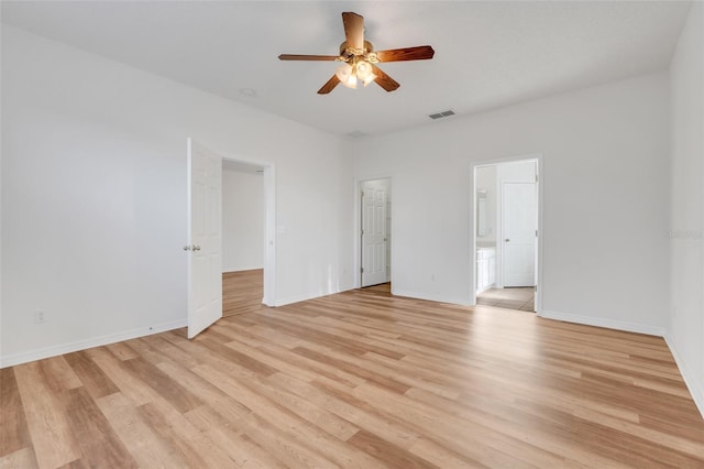9081 Saint Andrews Way, Mount Dora, FL 32757 - spare room with a ceiling fan, light wood-style flooring, and baseboards