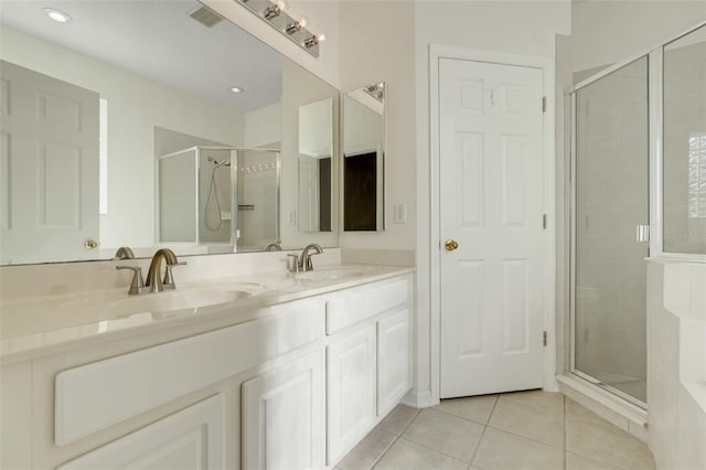 9081 Saint Andrews Way, Mount Dora, FL 32757 - full bathroom featuring tile patterned flooring, a shower stall, double vanity, and recessed lighting