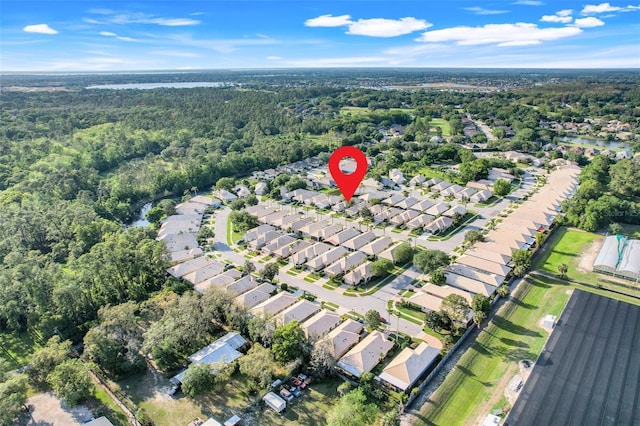 9081 Saint Andrews Way, Mount Dora, FL 32757 - aerial view of property and surrounding area featuring nearby suburban area and a forest