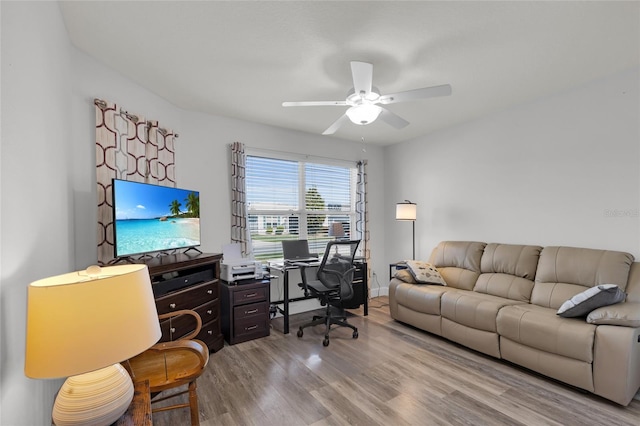 home office featuring wood finished floors and ceiling fan