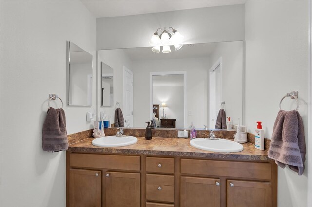 ensuite bathroom with a sink, double vanity, and ensuite bath